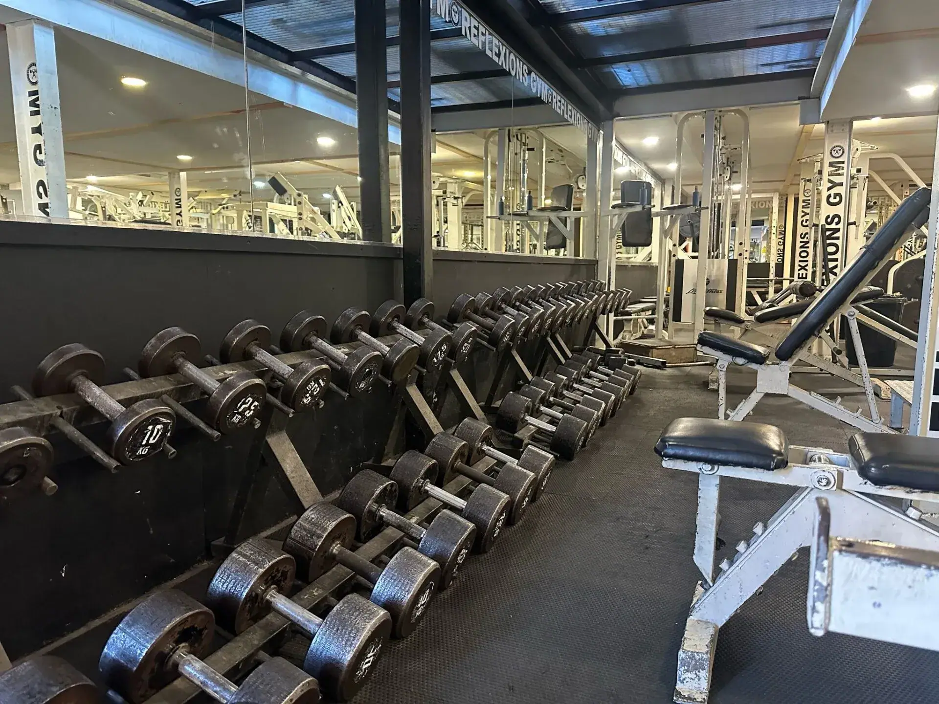 Free weights and benches in Reflexions Gym
