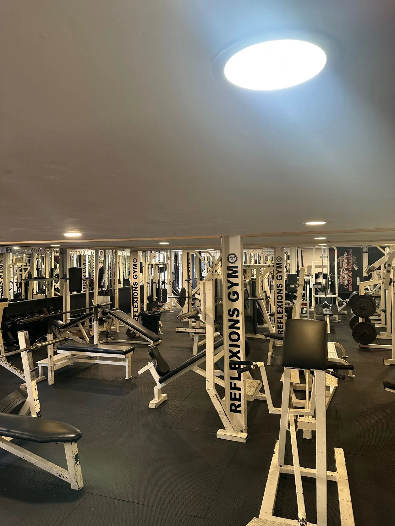 Reflexions Gym's free-weight and strength training area